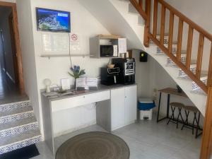 Kuchyň nebo kuchyňský kout v ubytování Hostal RENCH