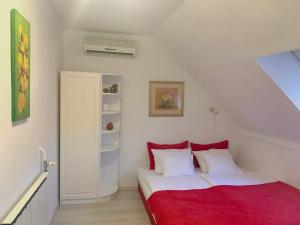 Posteľ alebo postele v izbe v ubytovaní Flair Apartmanház