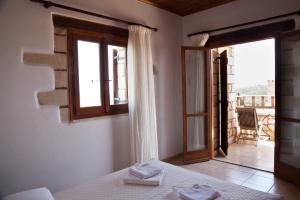 A bed or beds in a room at Tsivaras Villas