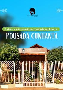 a gate and fence elements pico voiceeper in front of a building at Pousada Cunhantã in Alter do Chao