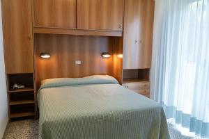 Postel nebo postele na pokoji v ubytování Hotel Cinzia