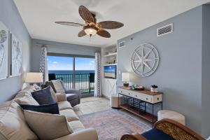 a living room with a couch and a ceiling fan at Sundunes Unit 133 in Navarre