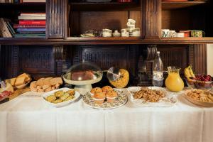 a table topped with plates of food on a table at B&B Il Bed and Bookfast in Mercatello
