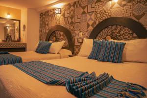 Postel nebo postele na pokoji v ubytování Hotel Tepeyac