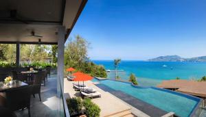 a view of the ocean from a house with a swimming pool at Amari Phuket in Patong Beach