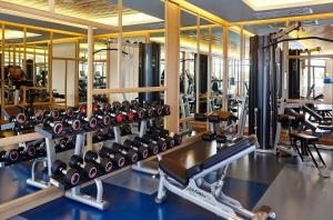 a gym with a lot of tread machines at Amari Phuket in Patong Beach