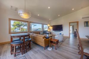 a living room with a couch and a table at 3 bd 3 ba and Bunks - Blue Door Retreat - New in 2024 in Lincoln City