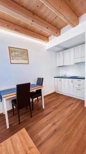 a kitchen and dining room with a table and chairs at Agriturismo La Collina delle Api in Castelcucco +62 photos