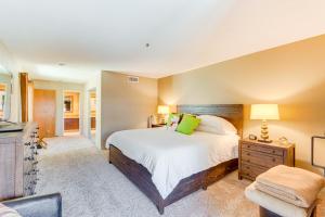 a bedroom with a large bed and a television at Community Pool Access Chic Palm Springs Condo in Palm Springs +26 photos