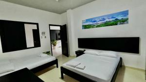 Postel nebo postele na pokoji v ubytování hotel puinawai