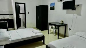 Postel nebo postele na pokoji v ubytování hotel puinawai