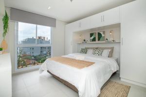 Letto o letti in una camera di Stylish 2BR Apt in Top Location