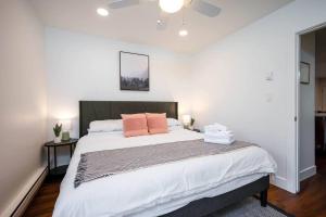 a bedroom with a large bed with two pillows on it at Welcoming Wolf Getaway in Eden +34 photos