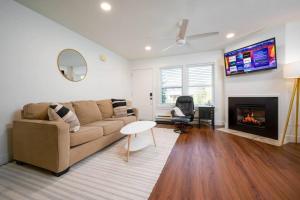 a living room with a couch and a fireplace at Welcoming Wolf Getaway in Eden