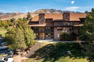 an aerial view of a house with mountains in the background at Welcoming Wolf Getaway in Eden