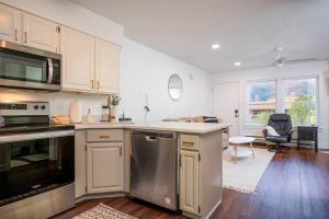 a kitchen with a sink and a stove top oven at Welcoming Wolf Getaway in Eden