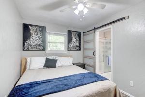 a bedroom with a bed and a ceiling fan at Cozy Home Near Downtown Lawton in Lawton
