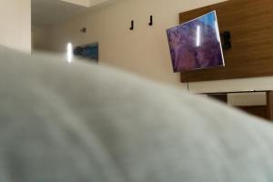 Et tv og/eller underholdning på Infinity Suites habitacion doble 102 + 9 billeder