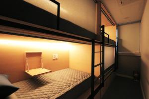 Postel nebo postele na pokoji v ubytování Blueboat Hostel Gyeongju