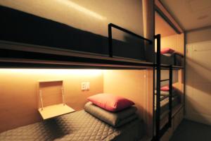 Postel nebo postele na pokoji v ubytování Blueboat Hostel Gyeongju