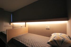 Postel nebo postele na pokoji v ubytování Blueboat Hostel Gyeongju