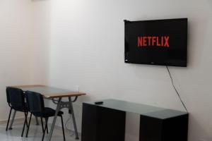 Et tv og/eller underholdning på Infinity Suites Habitación Triple 103