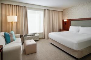Cama ou camas em um quarto em TownePlace Suites by Marriott Orlando Downtown