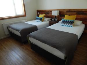 Postel nebo postele na pokoji v ubytování Hostal Buenavista Patagonia
