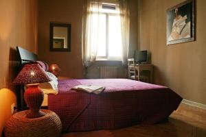 Postel nebo postele na pokoji v ubytování B&B Quo Vadis Arena