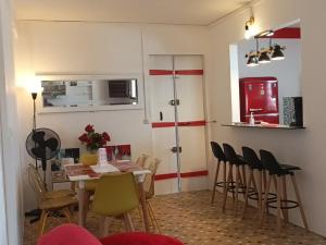 a kitchen with a table and chairs in a room at Kaz à joss in Basse-Pointe