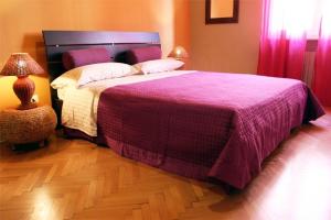 Postel nebo postele na pokoji v ubytování B&B Quo Vadis Arena