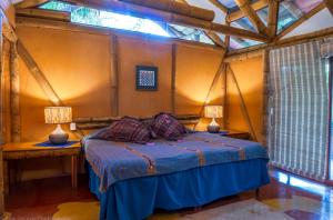 Postel nebo postele na pokoji v ubytování Reserva Natural Atitlan