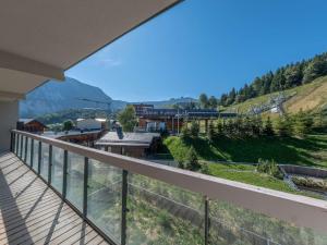 a view from the balcony of a house at Magnifique appart 6 personnes près des pistes avec SPA et Parking à Courchevel 1550 - FR-1-631-207 in Courchevel