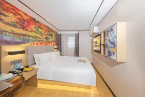 Voodi või voodid majutusasutuse Yimimi Apartment - Guangzhou 13th Line Yide Road Metro Station toas