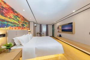 Voodi või voodid majutusasutuse Yimimi Apartment - Guangzhou 13th Line Yide Road Metro Station toas