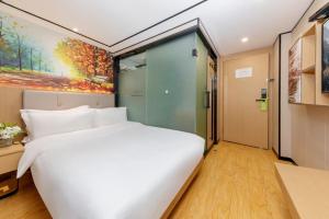 Voodi või voodid majutusasutuse Yimimi Apartment - Guangzhou 13th Line Yide Road Metro Station toas