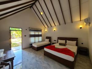Postel nebo postele na pokoji v ubytování Sigiriya Nature Resort