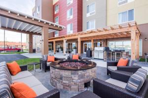 a patio with furniture and a fire pit with a grill at TownePlace Suites by Marriott Cleveland in Cleveland