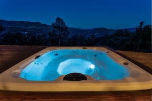 a jacuzzi tub with a view of the mountains at Yosemite Sunrise House with hot tub/views/game room! in Yosemite Forks
