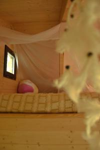 a childs bed in a tiny house at Treehouse Velké Losiny in Velké Losiny