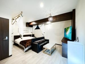 Postel nebo postele na pokoji v ubytování Hotel BaliBali Matsudo
