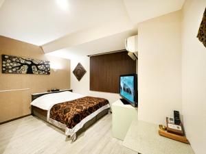 Letto o letti in una camera di Hotel BaliBali Matsudo