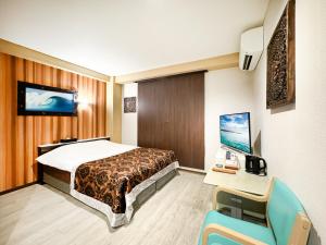 Letto o letti in una camera di Hotel BaliBali Matsudo