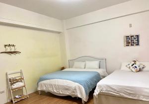 Letto o letti in una camera di 宜蘭凱西在家親子民宿 包棟 電動麻將 飛鏢機 夏日戲水池