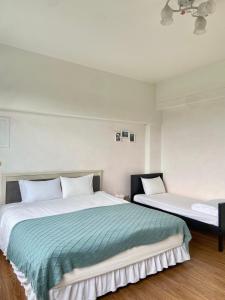 Letto o letti in una camera di 宜蘭凱西在家親子民宿 包棟 電動麻將 飛鏢機 夏日戲水池