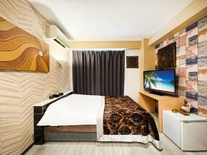 Letto o letti in una camera di Hotel BaliBali Matsudo
