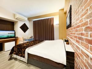 Letto o letti in una camera di Hotel BaliBali Matsudo