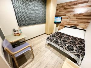 Letto o letti in una camera di Hotel BaliBali Matsudo
