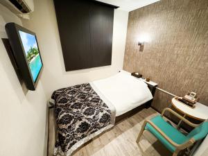 Letto o letti in una camera di Hotel BaliBali Matsudo