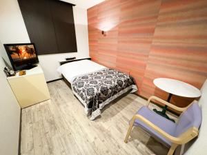 Letto o letti in una camera di Hotel BaliBali Matsudo